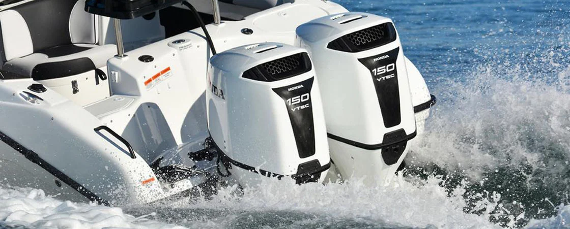 honda outboard motor powering a family cruising boat