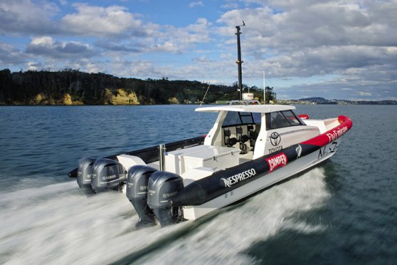 offshore fishing boat powered by twin high horsepower outboard motors.